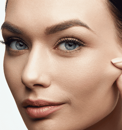 close up portrait of a woman pinching her cheek